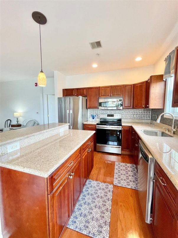 Interior, Kitchen, Pendant Lights, Recessed Lighting, Stainless Steel Appliances, Wood Texture Flooring
