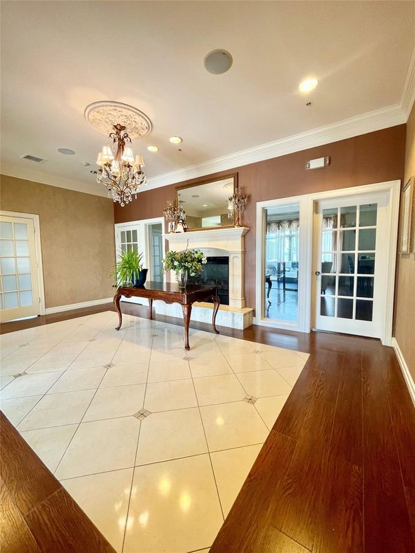 Chandelier, Empty room, Fireplace, Interior, Recessed Lighting, Wood Texture Flooring