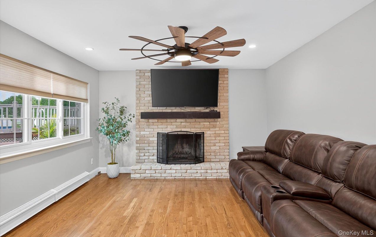 Fireplace, Interior, Living room, Recessed Lighting, Stone Walls, Wood Texture Flooring