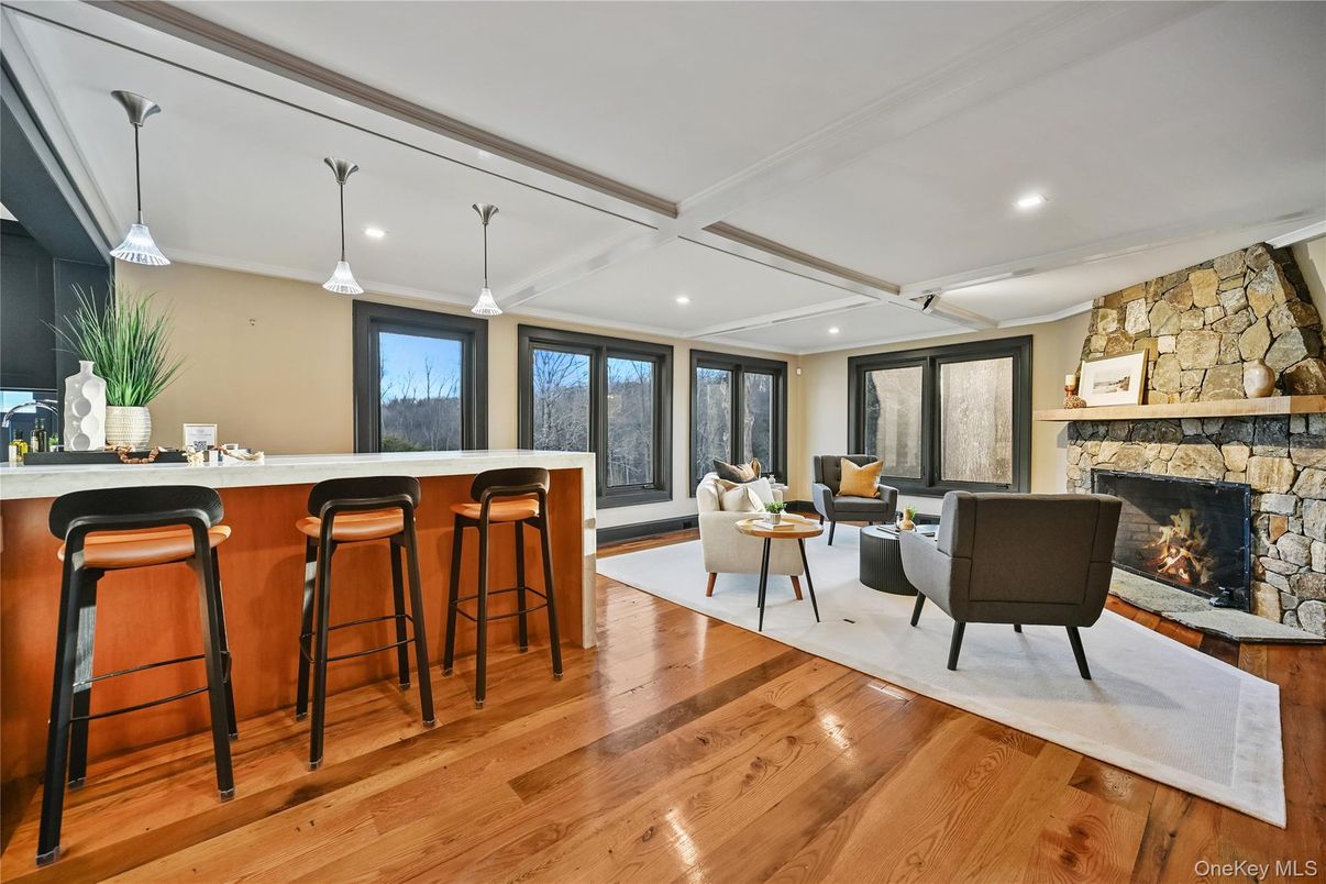 Fireplace, Interior, Living room, Pendant Lights, Recessed Lighting, Stone Walls, Wood Texture Flooring