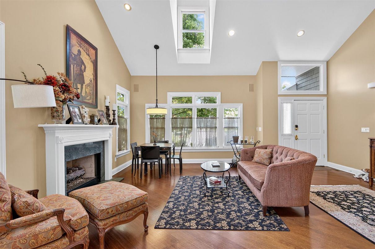 Dining room, Fireplace, Interior, Living room, Pendant Lights, Recessed Lighting, Wood Texture Flooring