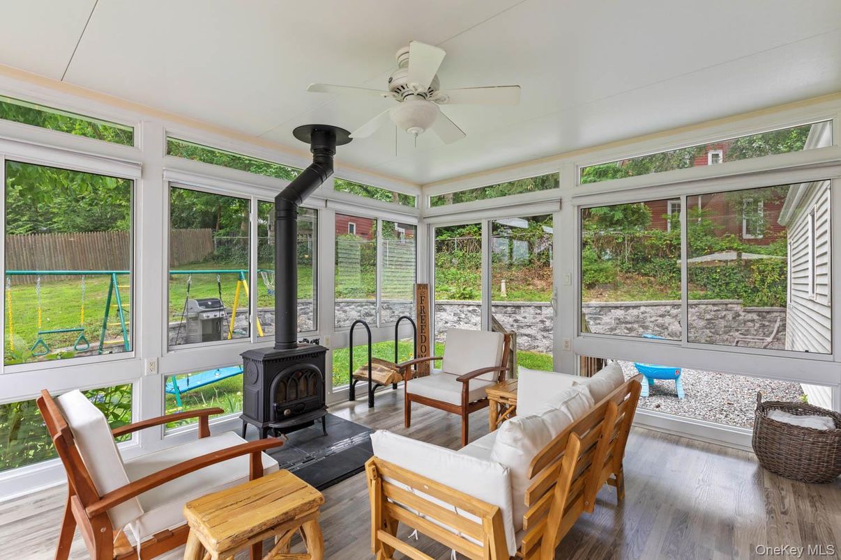 Fireplace, Interior, Sun Room, Wood Texture Flooring