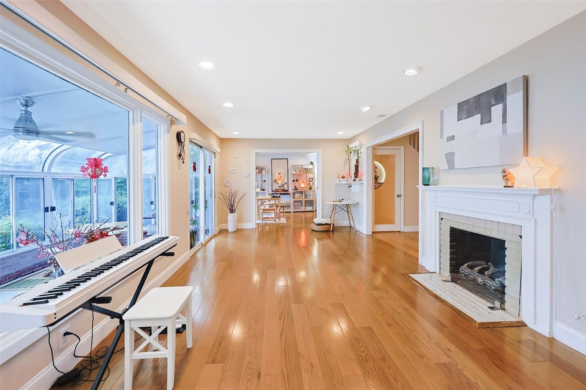 Fireplace, Interior, Piano, Recessed Lighting, Wood Texture Flooring