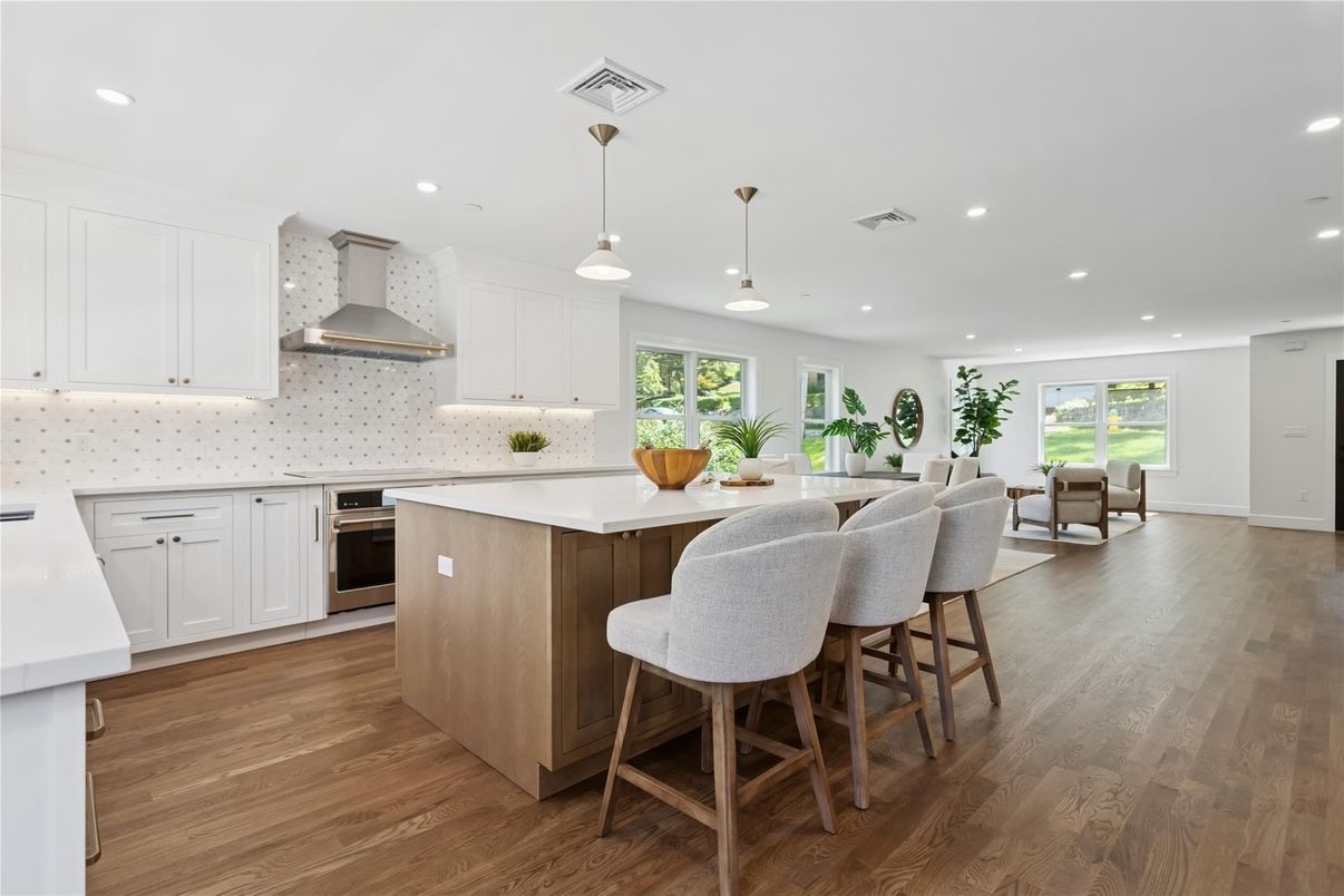 Dining room, Interior, Kitchen, Pendant Lights, Recessed Lighting, Stainless Steel Appliances, Wood Texture Flooring