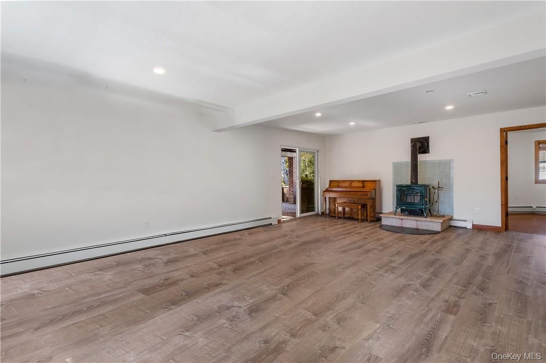 Empty room, Fireplace, Interior, Piano, Recessed Lighting, Wood Texture Flooring