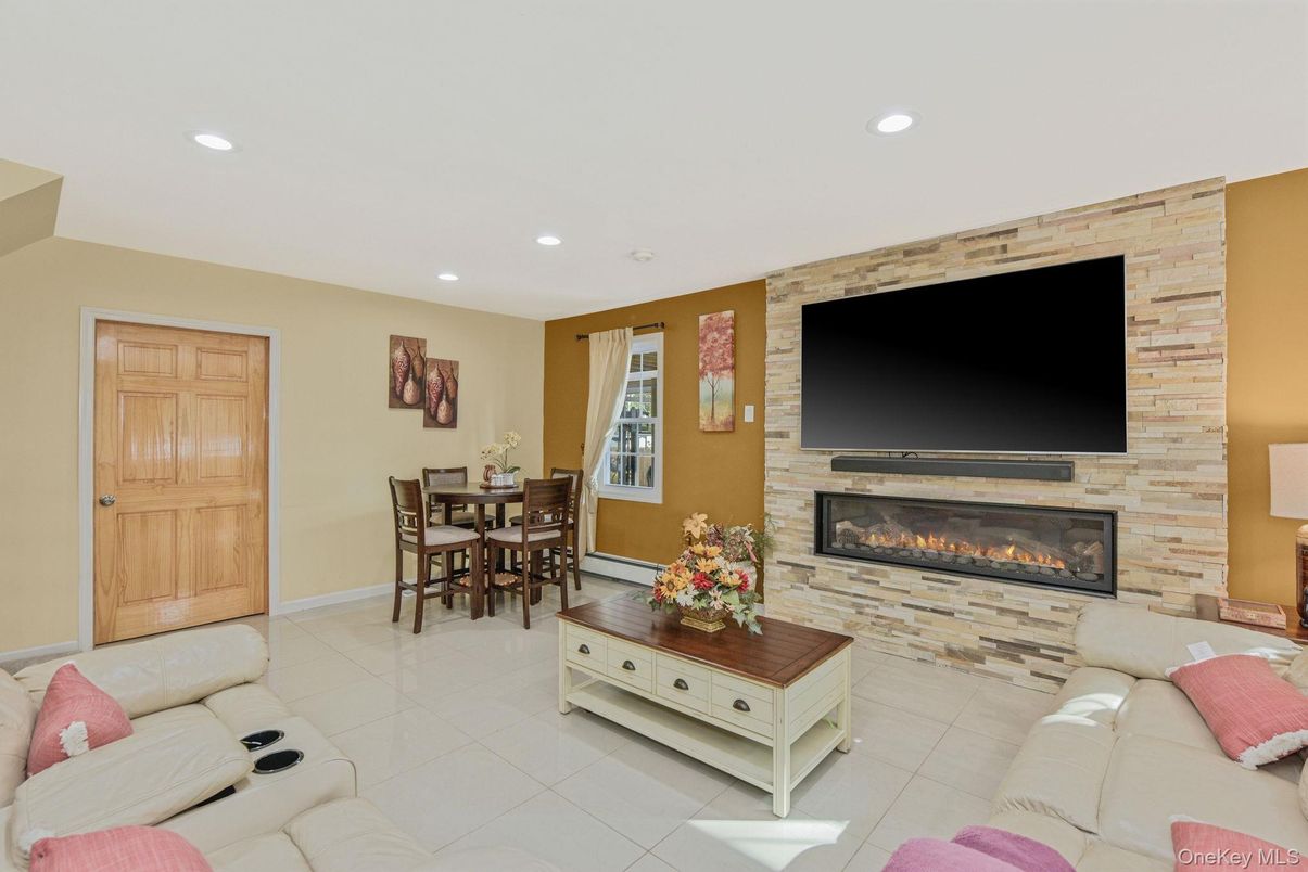 Dining room, Fireplace, Interior, Living room, Recessed Lighting, Stone Walls