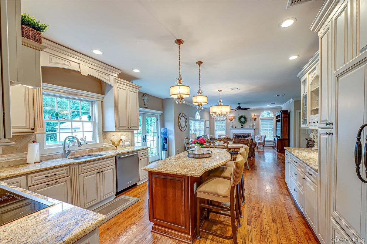 Dining room, Fireplace, Interior, Kitchen, Pendant Lights, Recessed Lighting, Wood Texture Flooring