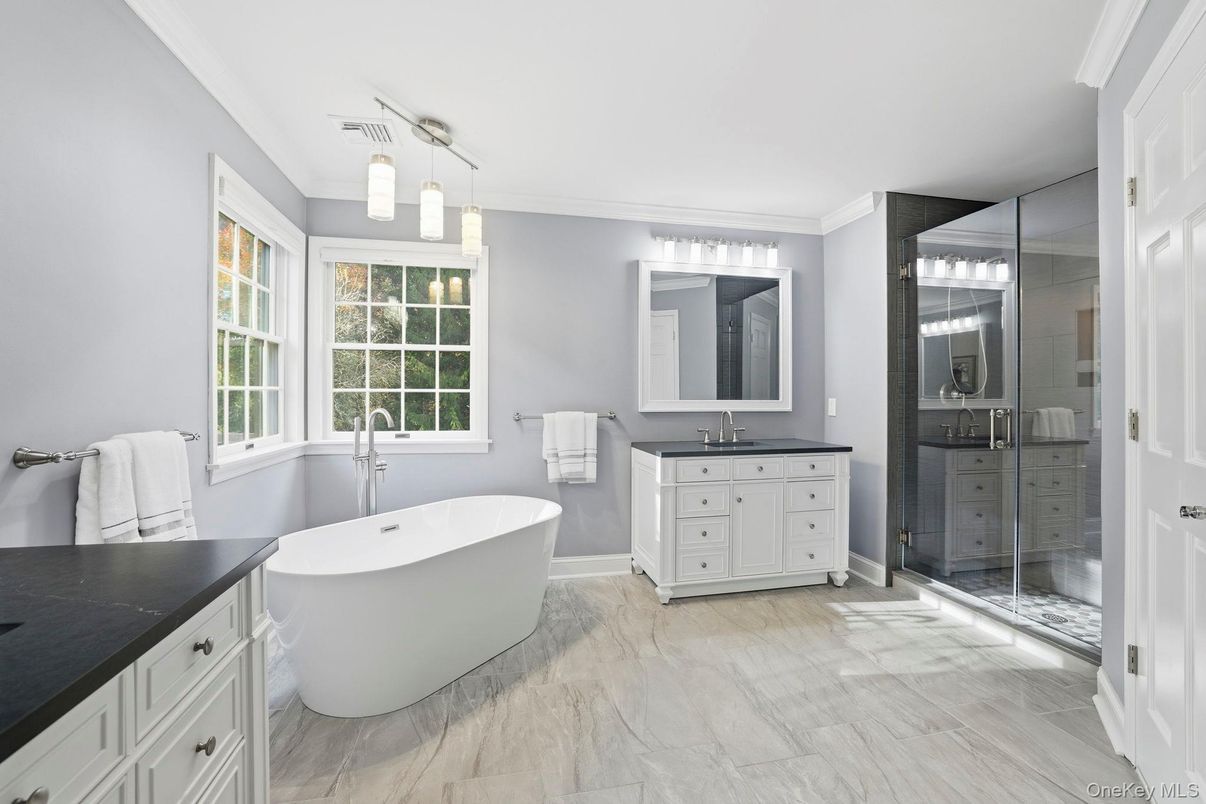 Bathroom, Dual Sink Vanities, Free Standing Baths, Glass Shower, Interior, Marble, Pendant Lights, Wood Texture Flooring