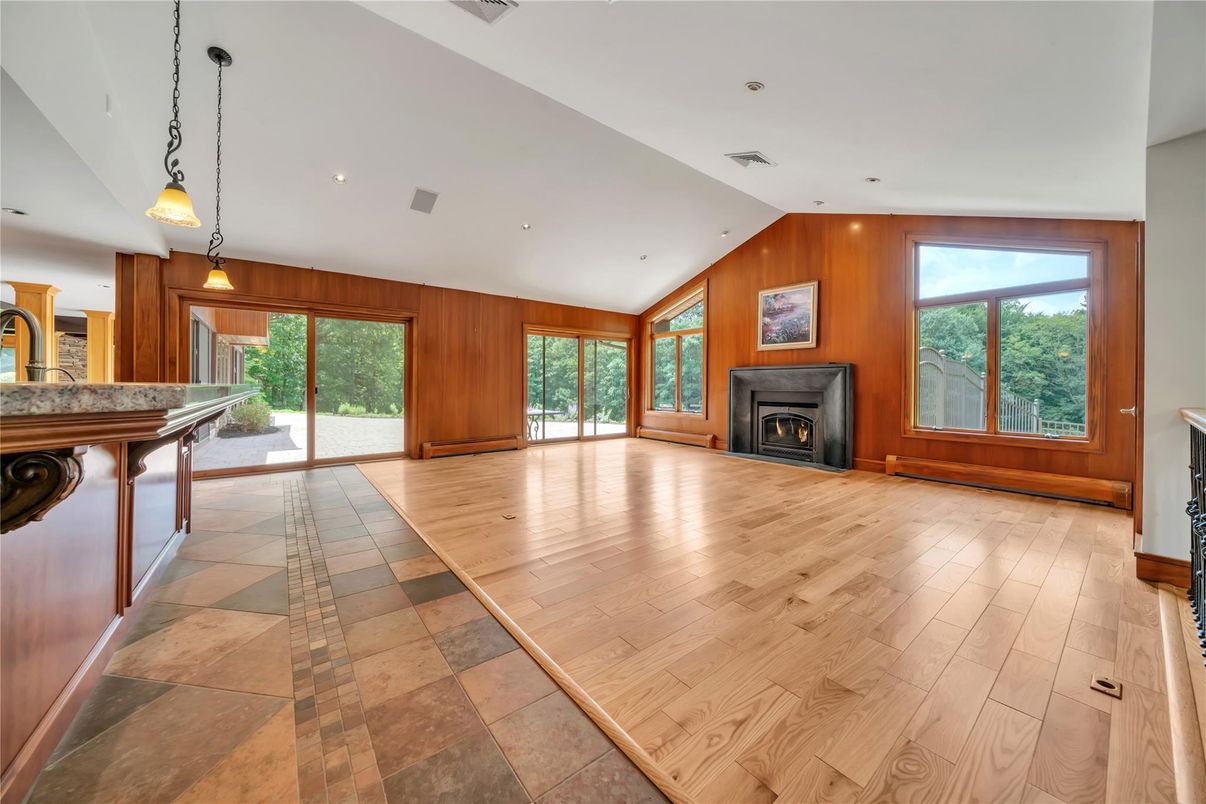 Empty room, Fireplace, Interior, Pendant Lights, Recessed Lighting, Wood Texture Flooring, Wooden Walls