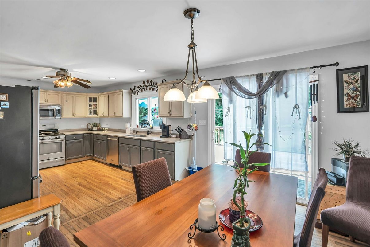 Dining room, Interior, Kitchen, Pendant Lights, Recessed Lighting, Stainless Steel Appliances, Wood Texture Flooring