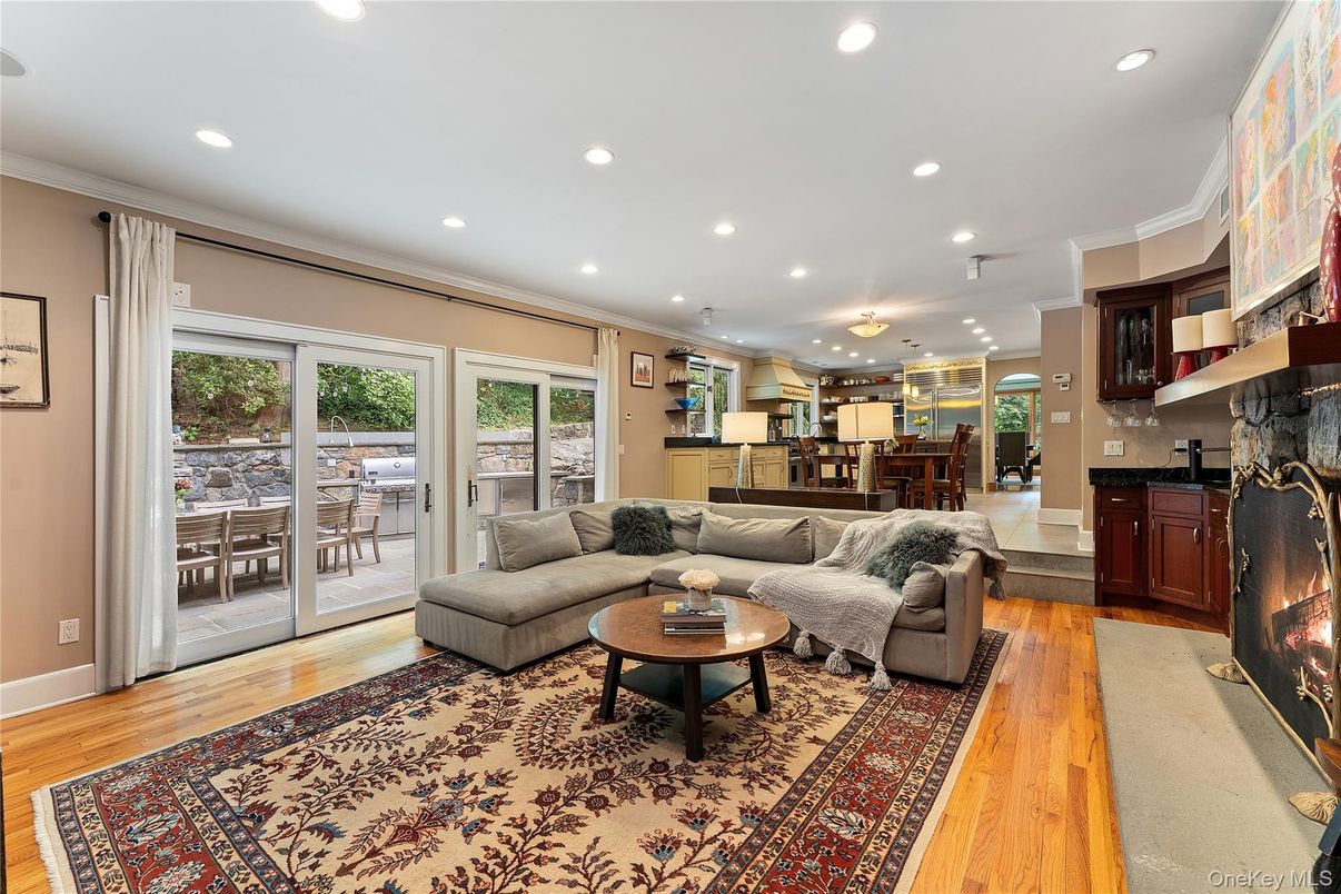 Dining room, Fireplace, Interior, Living room, Recessed Lighting, Wood Texture Flooring