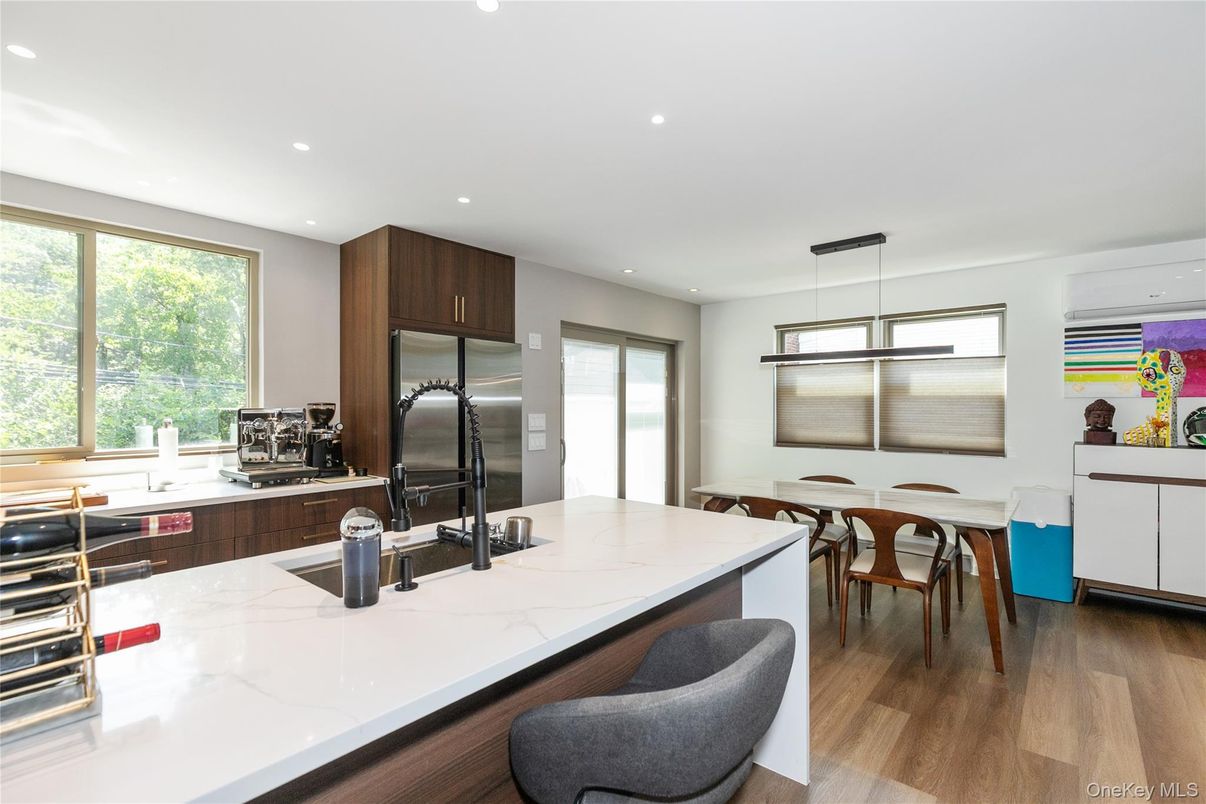 Dining room, Interior, Kitchen, Pendant Lights, Recessed Lighting, Stainless Steel Appliances, Wood Texture Flooring