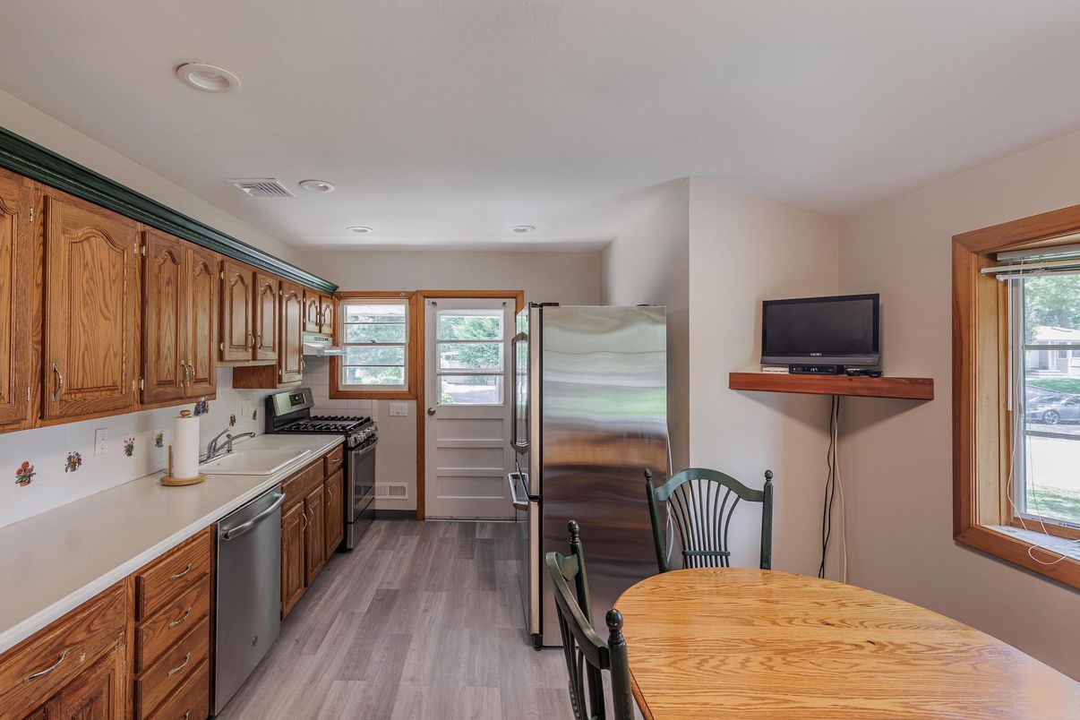 Dining room, Interior, Kitchen, Recessed Lighting, Stainless Steel Appliances, Wood Texture Flooring