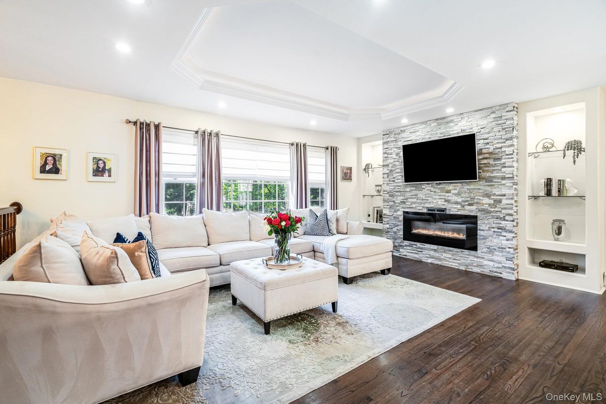 Fireplace, Interior, Living room, Recessed Lighting, Stone Walls, Wood Texture Flooring