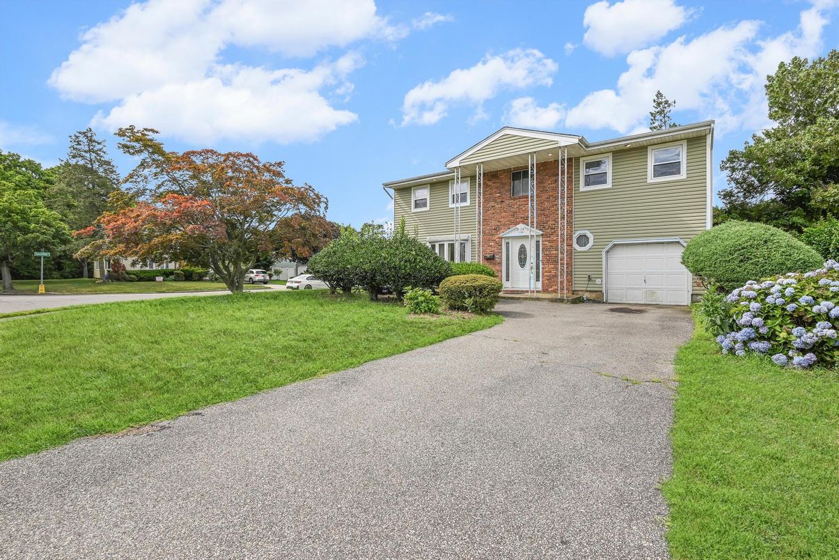 Attached, Backyard, Exterior, Facade, Brick Facade, Raised Ranch