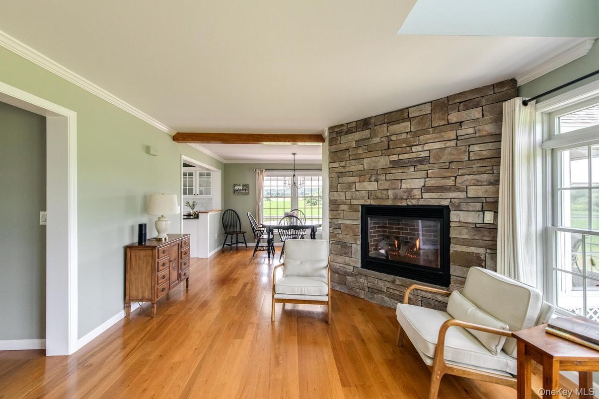 Chandelier, Dining room, Fireplace, Interior, Pendant Lights, Stone Walls, Wood Texture Flooring