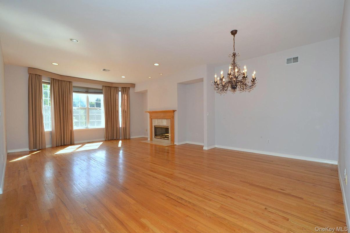 Chandelier, Empty room, Fireplace, Interior, Recessed Lighting, Wood Texture Flooring