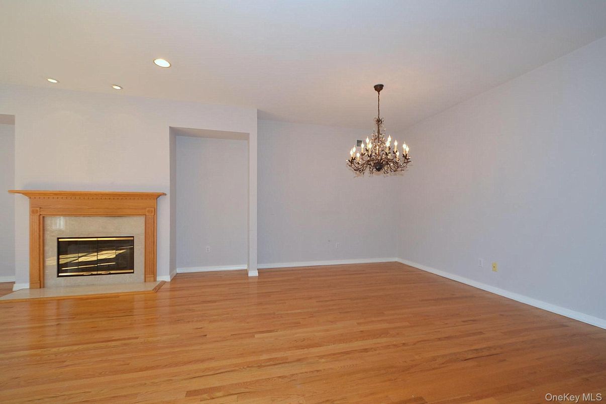 Chandelier, Empty room, Fireplace, Interior, Recessed Lighting, Wood Texture Flooring