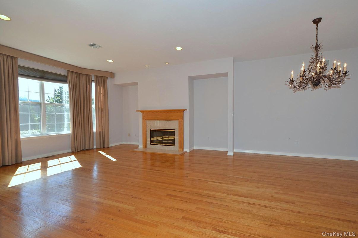 Chandelier, Empty room, Fireplace, Interior, Recessed Lighting, Wood Texture Flooring