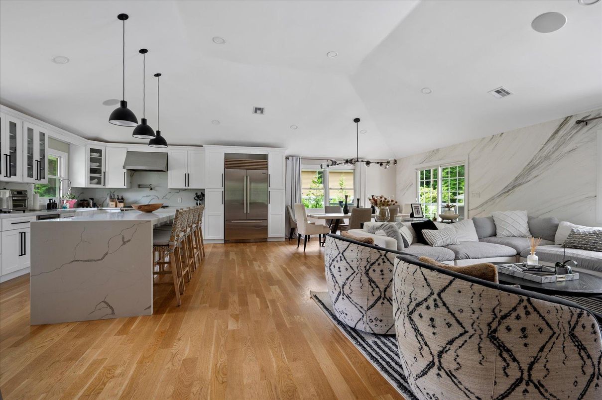 Dining room, Interior, Kitchen, Living room, Marble Walls, Pendant Lights, Recessed Lighting, Stainless Steel Appliances, Wood Texture Flooring