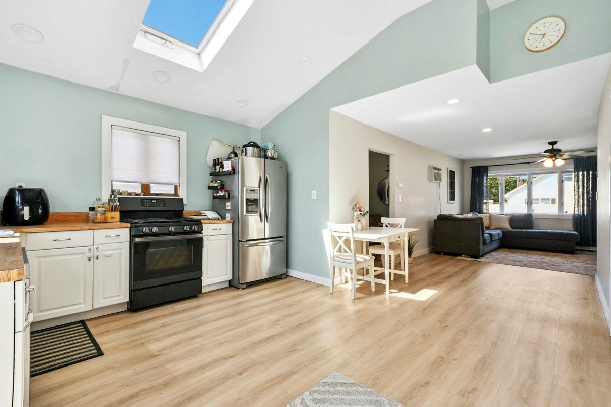 Dining room, Interior, Kitchen, Living room, Recessed Lighting, Stainless Steel Appliances, Wood Texture Flooring