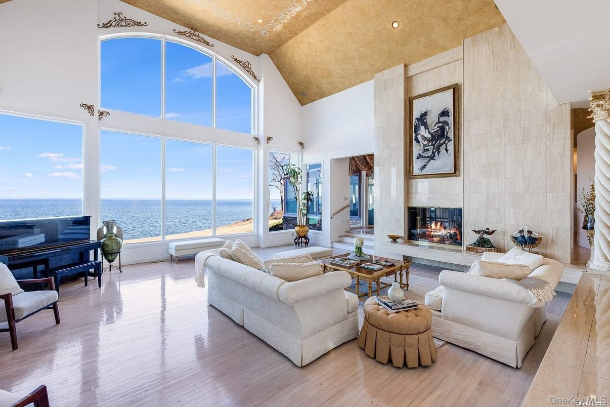 Fireplace, Interior, Living room, Piano, Recessed Lighting, Water, Wood Texture Flooring
