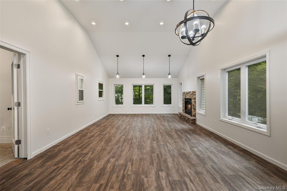 Empty room, Fireplace, Interior, Pendant Lights, Recessed Lighting, Wood Texture Flooring