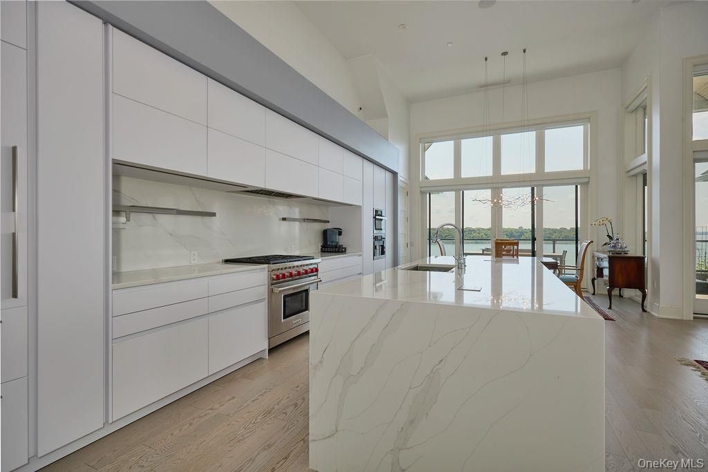 Interior, Kitchen, Marble Walls, Pendant Lights, Recessed Lighting, Stainless Steel Appliances, Wood Texture Flooring