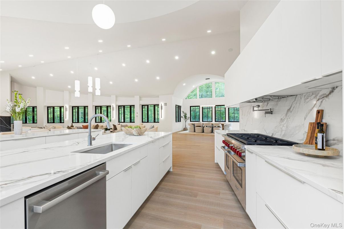 Interior, Kitchen, Marble Walls, Pendant Lights, Recessed Lighting, Stainless Steel Appliances, Wood Texture Flooring