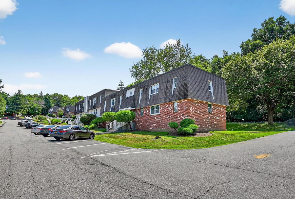 Exterior, Facade, Brick Facade, Condo Building
