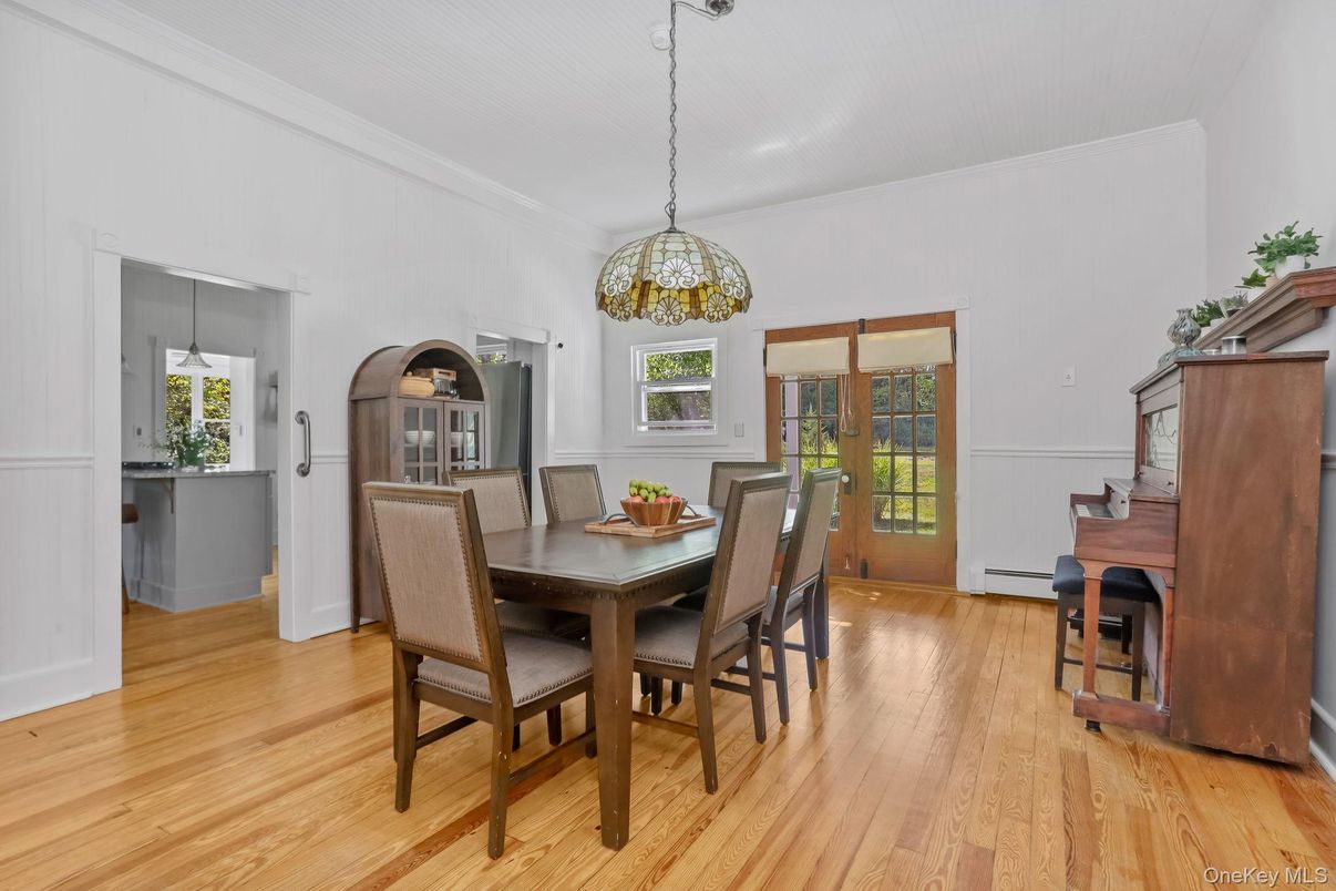 Dining room, Interior, Pendant Lights, Piano, Wood Texture Flooring