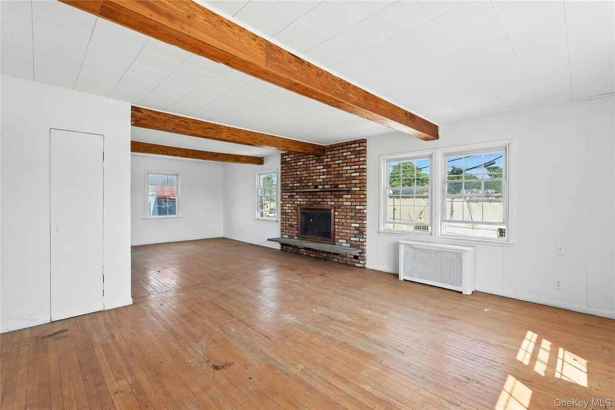 Empty room, Fireplace, Interior, Stone Walls, Wooden Beams, Wood Texture Flooring