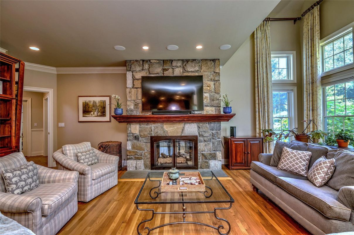 Fireplace, Interior, Living room, Recessed Lighting, Stone Walls, Wood Texture Flooring