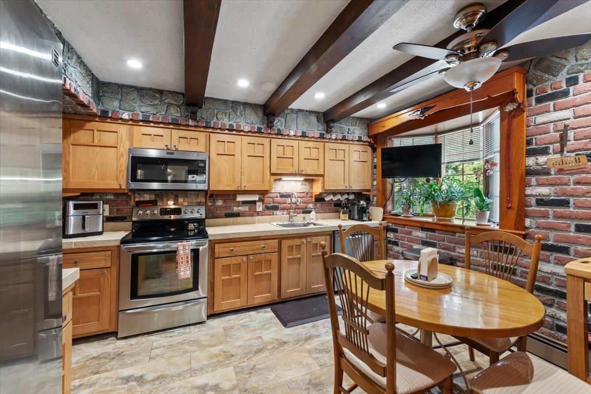 Dining room, Interior, Kitchen, Recessed Lighting, Stainless Steel Appliances, Stone Walls, Wooden Beams