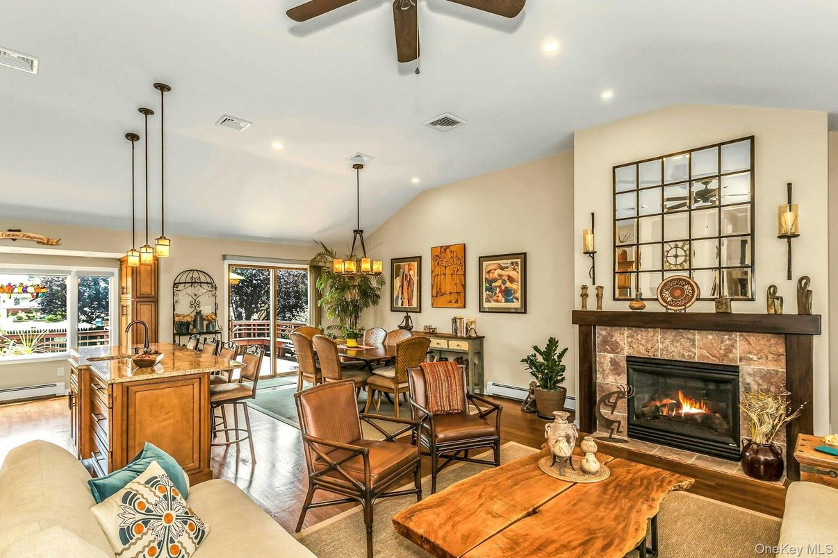 Chandelier, Dining room, Fireplace, Interior, Living room, Pendant Lights, Recessed Lighting, Wood Texture Flooring