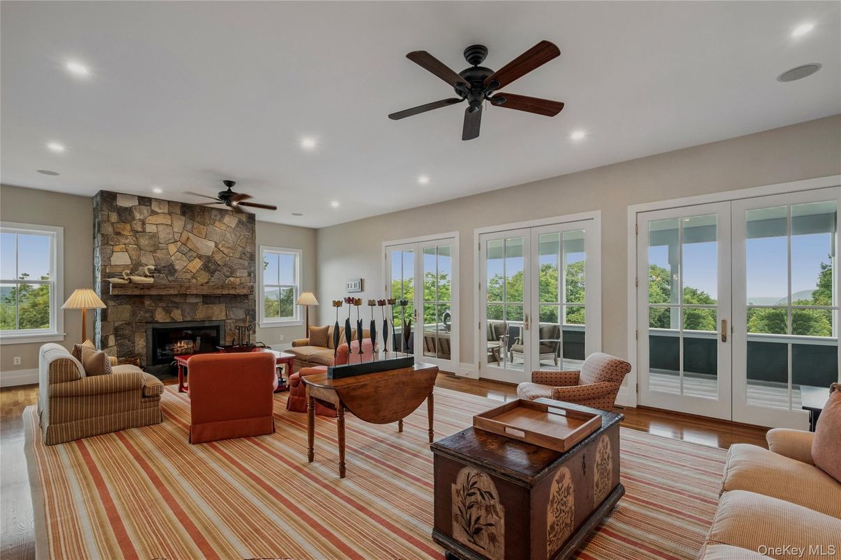 Fireplace, Interior, Living room, Recessed Lighting, Stone Walls, Wood Texture Flooring