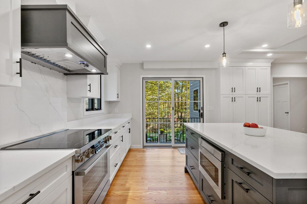 Interior, Kitchen, Marble Walls, Pendant Lights, Recessed Lighting, Stainless Steel Appliances, Wood Texture Flooring