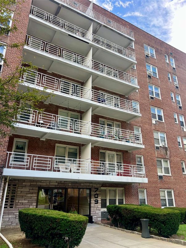 Exterior, Facade, Brick Facade, Condo Building