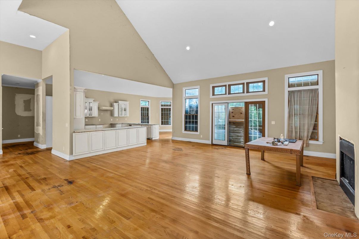 Fireplace, Game Room, Interior, Recessed Lighting, Wood Texture Flooring