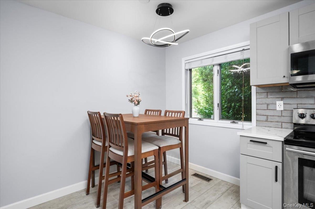 Dining room, Interior, Kitchen, Pendant Lights, Stainless Steel Appliances, Wood Texture Flooring