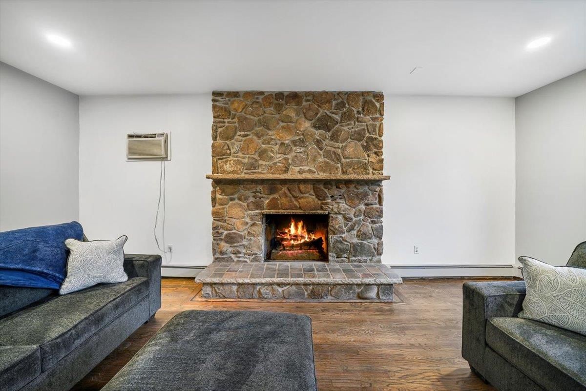 Fireplace, Interior, Recessed Lighting, Stone Walls, Wood Texture Flooring