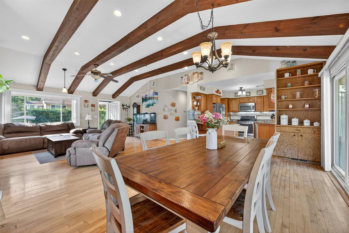 Chandelier, Dining room, Interior, Kitchen, Living room, Recessed Lighting, Stainless Steel Appliances, Wooden Beams, Wood Texture Flooring