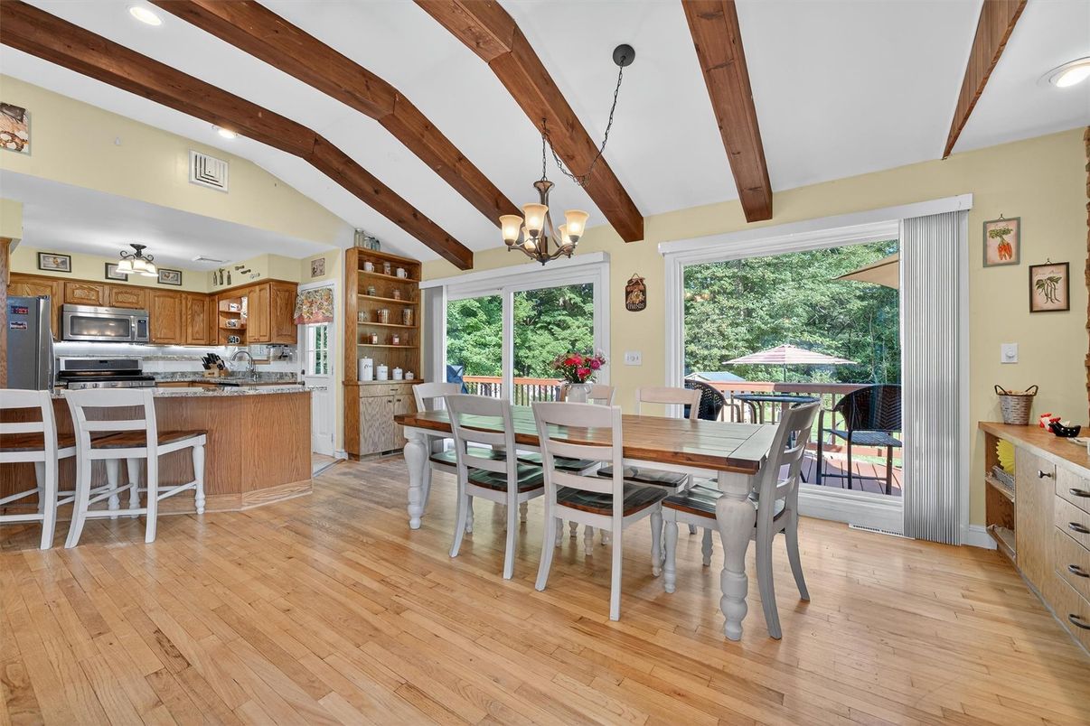 Chandelier, Dining room, Interior, Kitchen, Recessed Lighting, Stainless Steel Appliances, Wooden Beams, Wood Texture Flooring
