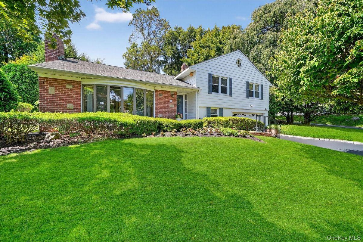 Attached, Backyard, Exterior, Facade, Brick Facade, Split Level