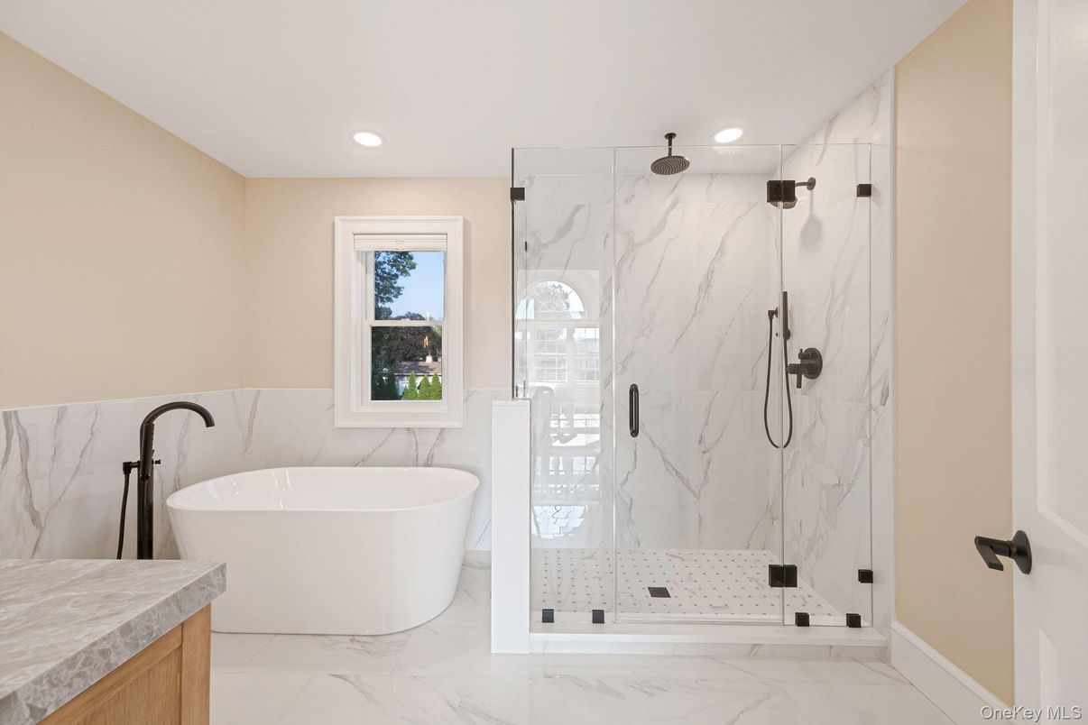 Bathroom, Free Standing Baths, Glass Shower, Interior, Marble, Marble Walls, Recessed Lighting