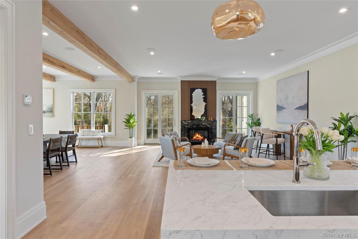 Dining room, Fireplace, Interior, Living room, Marble, Recessed Lighting, Wooden Beams, Wood Texture Flooring