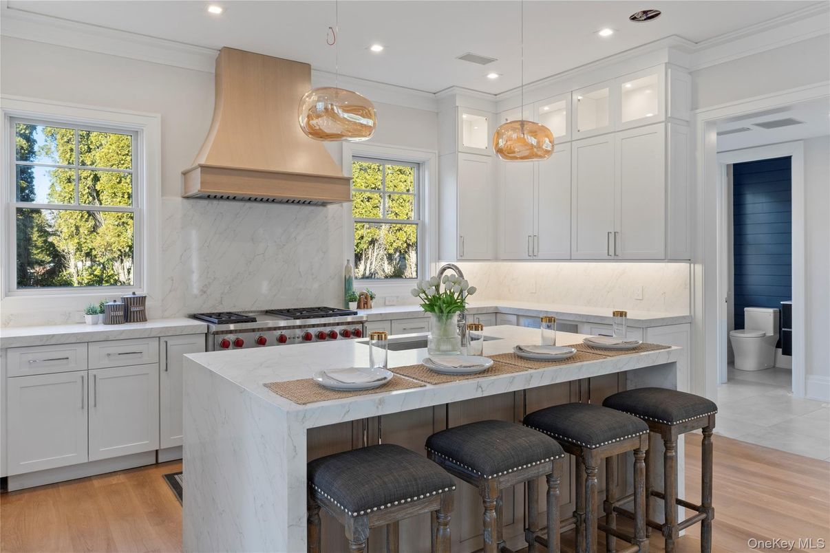 Interior, Kitchen, Marble Walls, Pendant Lights, Recessed Lighting, Stainless Steel Appliances, Wood Texture Flooring