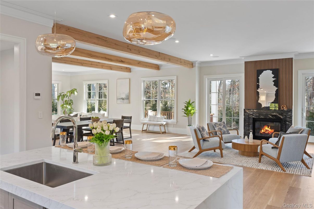 Dining room, Fireplace, Interior, Living room, Pendant Lights, Recessed Lighting, Wooden Beams, Wood Texture Flooring