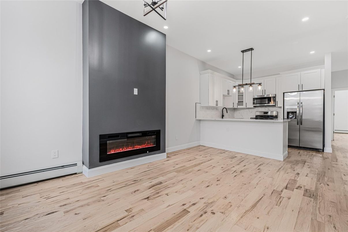 Fireplace, Interior, Kitchen, Pendant Lights, Recessed Lighting, Stainless Steel Appliances, Wood Texture Flooring