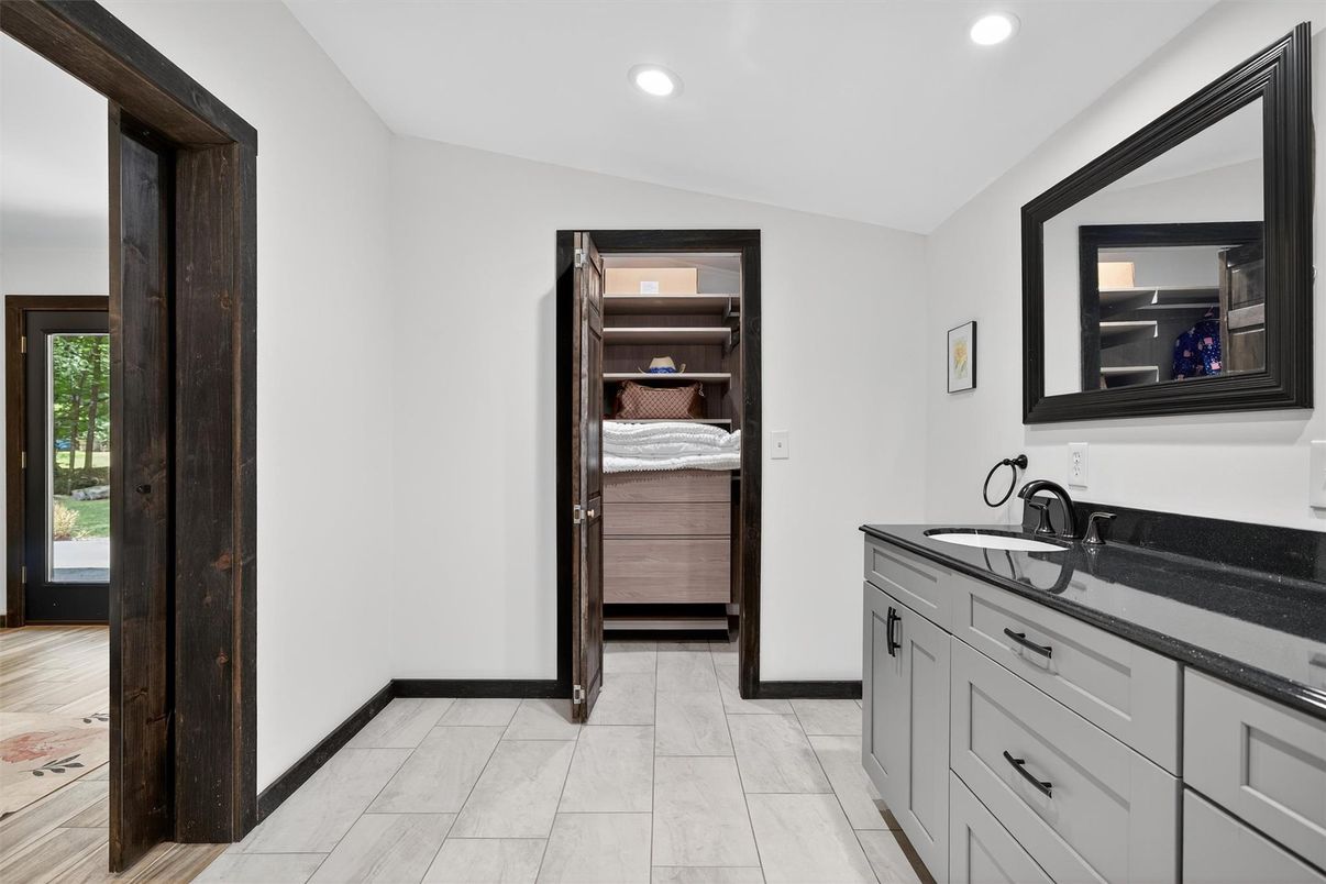 Bathroom, Dual Sink Vanities, Interior, Recessed Lighting, Wood Texture Flooring